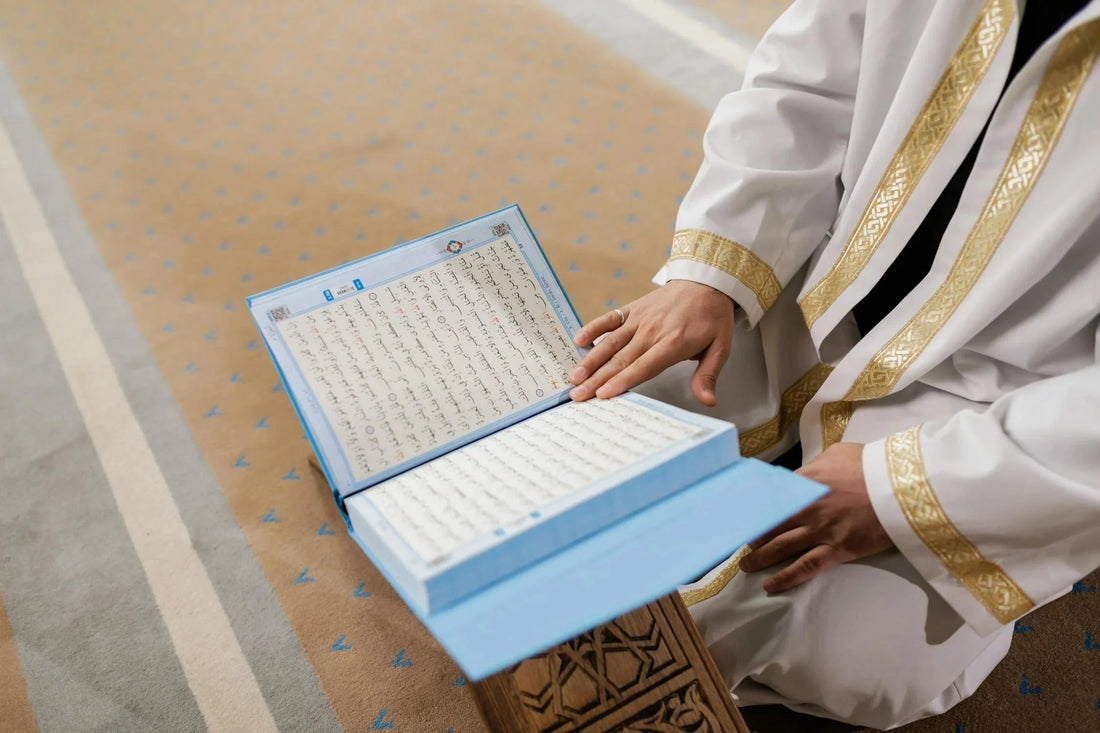 A man reading the Quran, the foundational text of Islamic theology